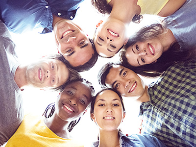 young people looking down at camera