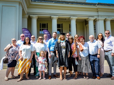 graduate with family