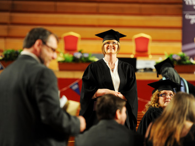 graduate smiling looking up