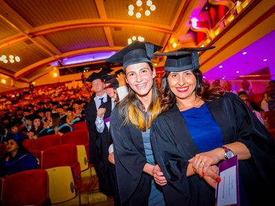 graduates smiling