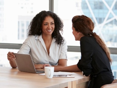 two people talking at table