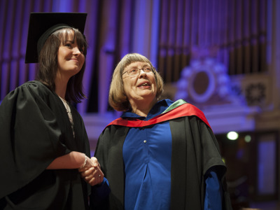 graduate shaking hands