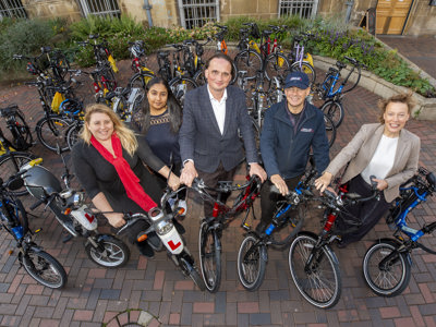 5 people with bikes smiling