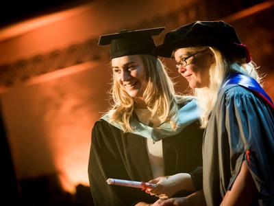 graduate receiving scroll