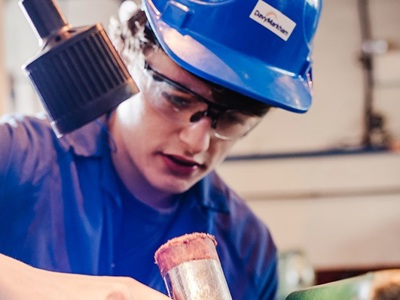 person in blue hard hat