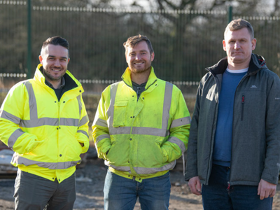 three people on construction site