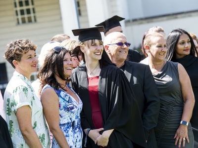 graduates with colleagues