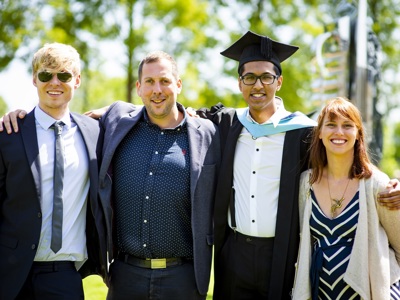 graduate with colleagues