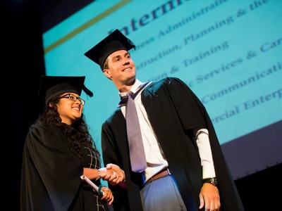 graduate receiving scroll